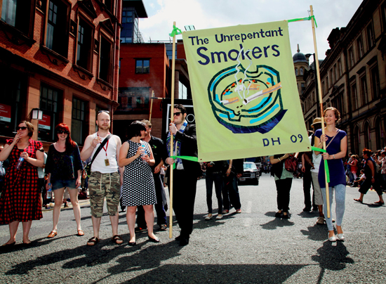 Jeremy Deller, Procession [detail], 2009, ‘The Unrepentant Smokers’, featuring banner designed by David Hockney and made by Ed Hall. Image courtesy the artist.